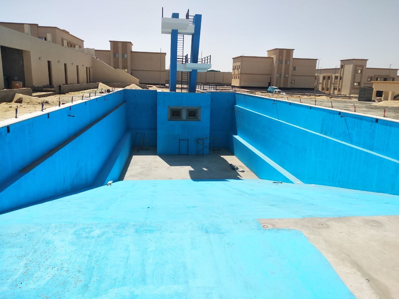Pool shell after blue waterproofing has been applied